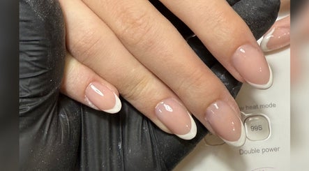 Elegant French manicure by HJ Beauty in Warrington, England, GB, showcasing pristine nail care.