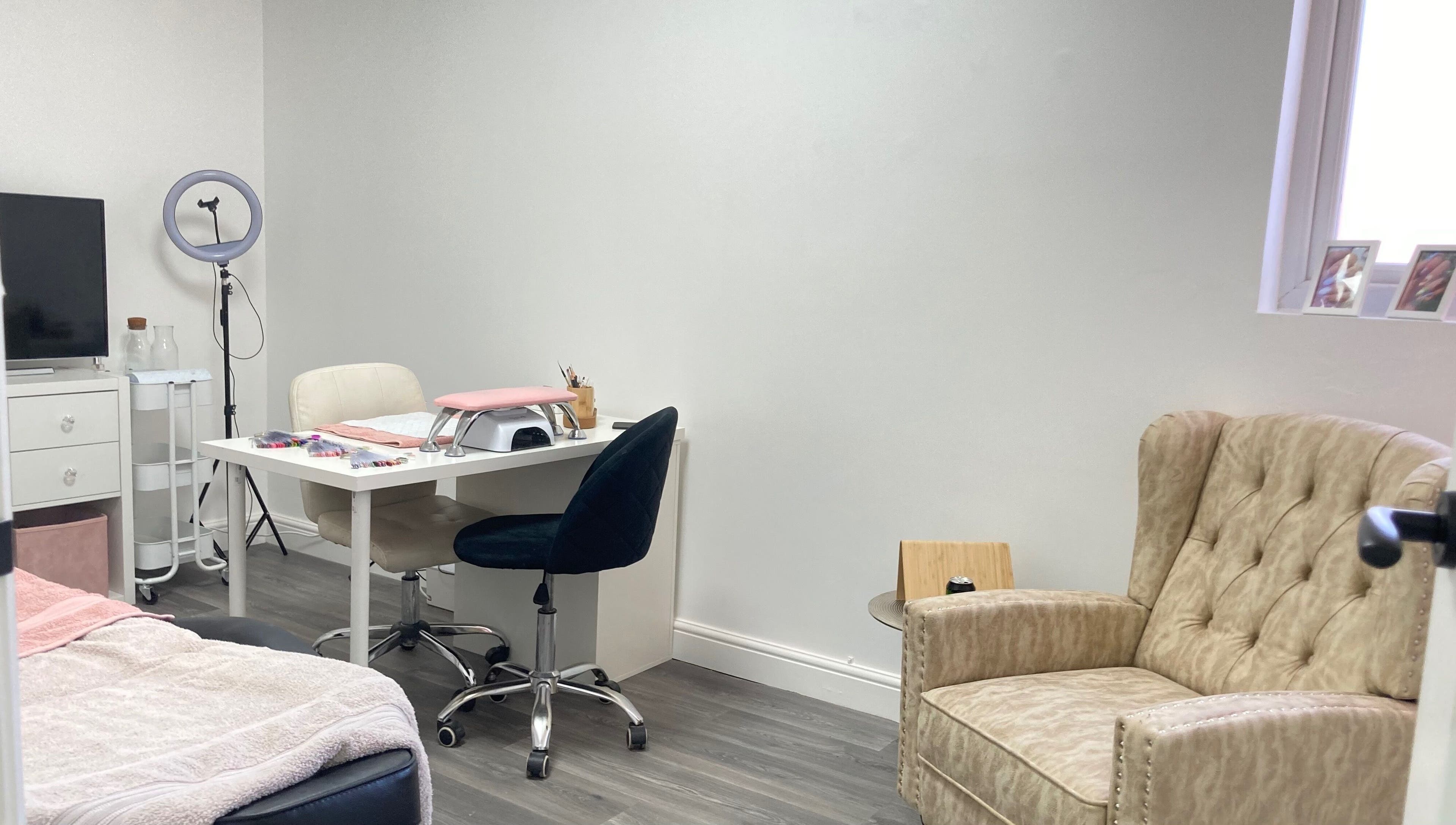 Cozy nail station at Summers Nails, Kidsgrove, England, GB, featuring plush seating and modern equipment.