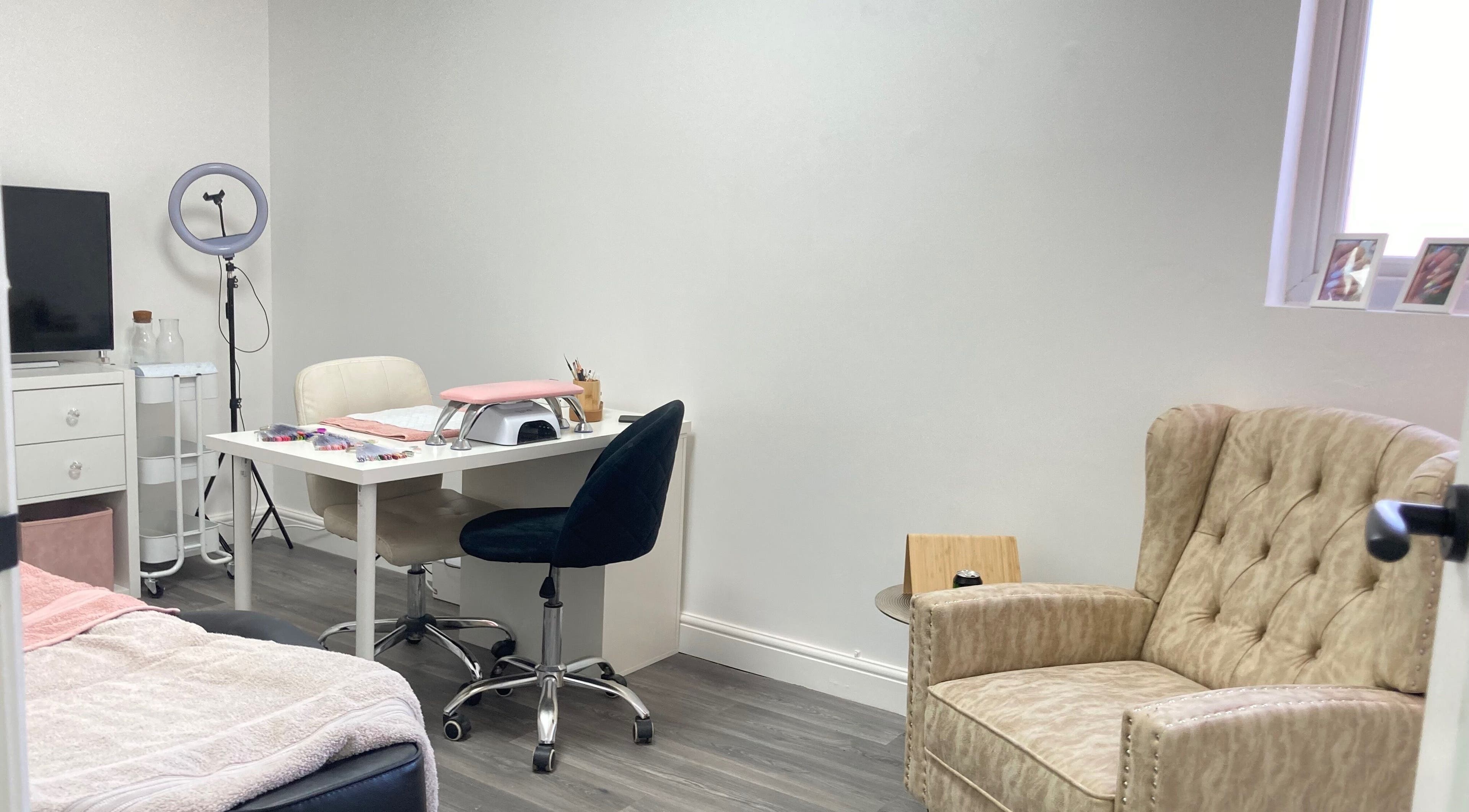 Cozy nail station at Summers Nails, Kidsgrove, England, GB, featuring plush seating and modern equipment.
