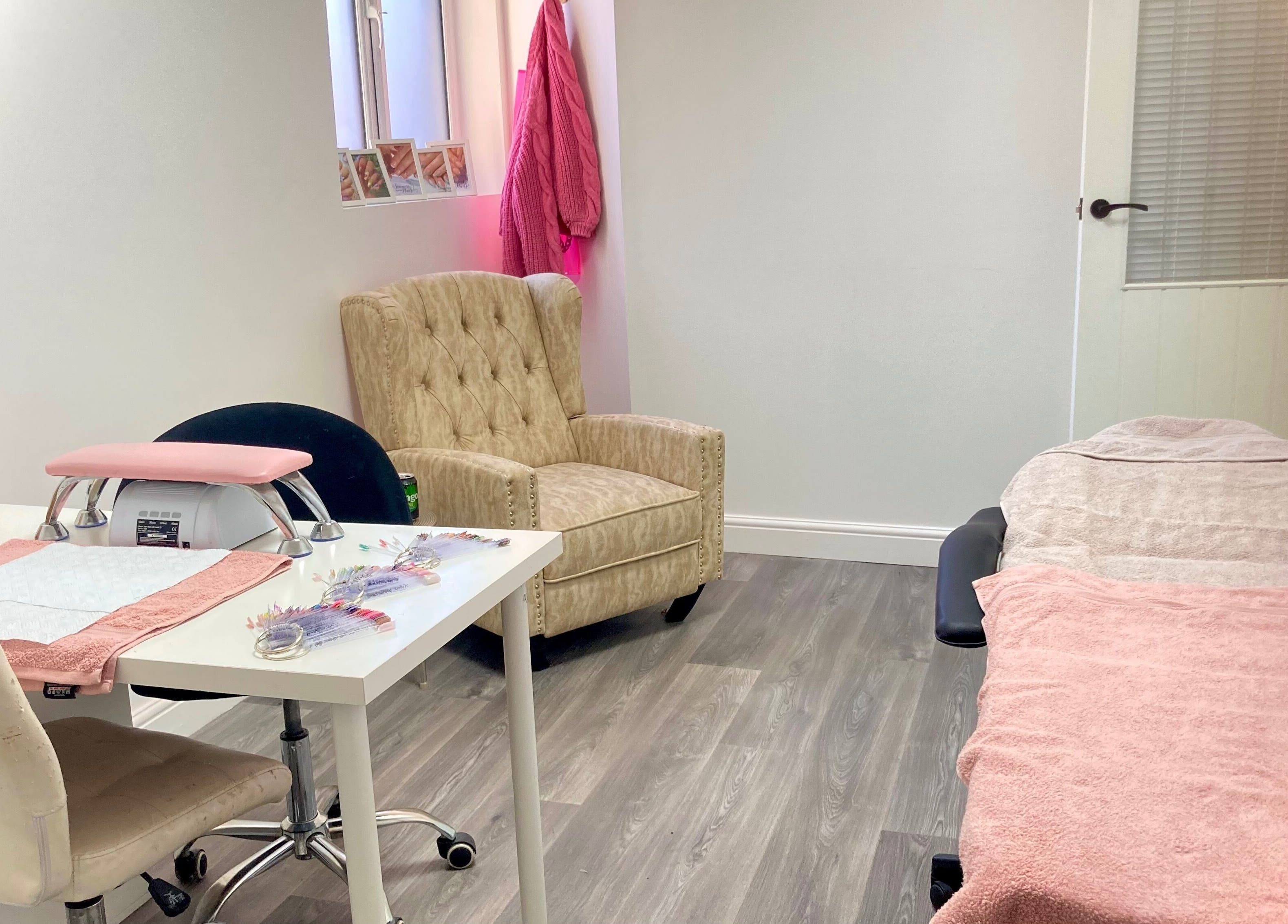 Relaxing interior of Summers nails in Kidsgrove, England. Comfortable seating and manicure table setup.