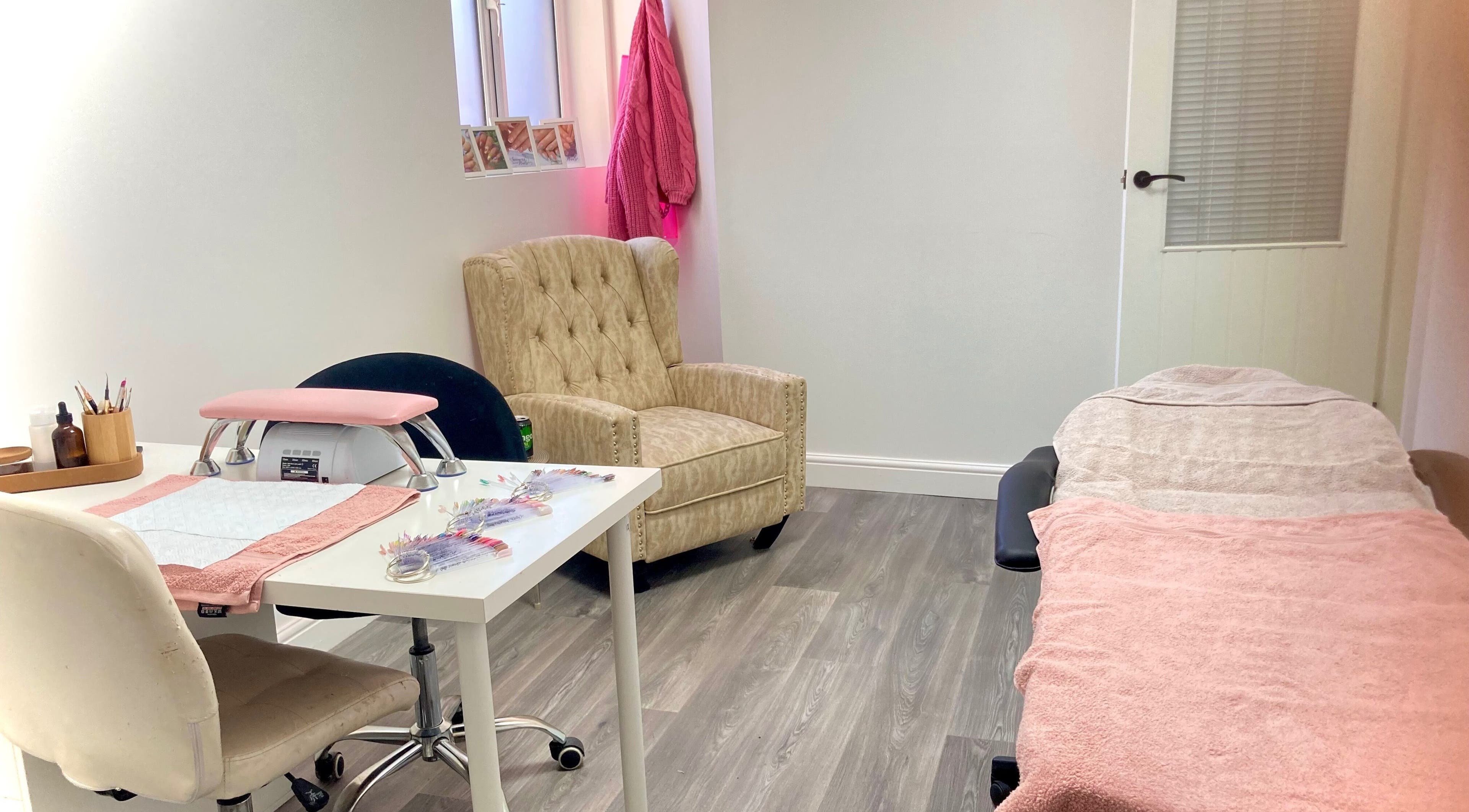 Relaxing interior of Summers nails in Kidsgrove, England. Comfortable seating and manicure table setup.