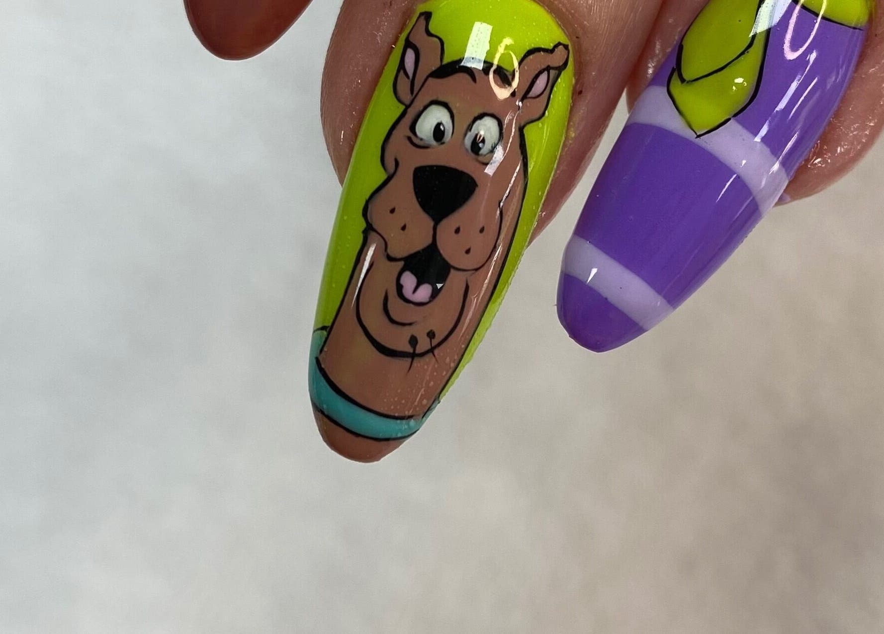 Fun cartoon-themed nail art at Summers Nails, Kidsgrove, England, GB.