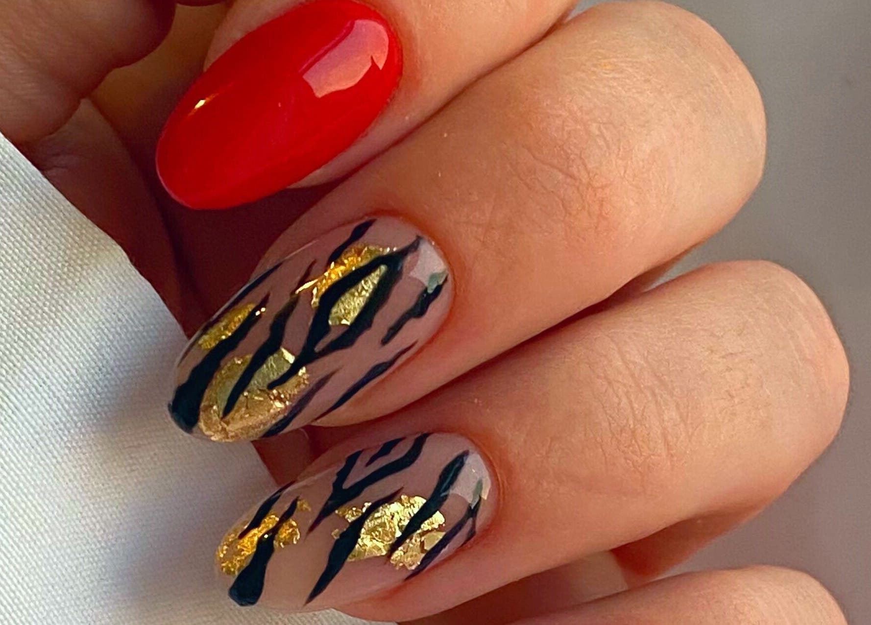 Elegant nail art with gold accents at Summers Nails, Kidsgrove, England, GB.