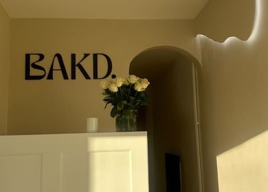 Elegant entrance at Beauty and the Baker, Hucclecote, England, featuring decor and soft lighting.