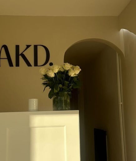 Elegant entrance at Beauty and the Baker, Hucclecote, England, featuring decor and soft lighting.