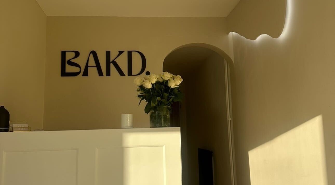 Elegant entrance at Beauty and the Baker, Hucclecote, England, featuring decor and soft lighting.