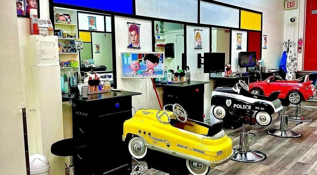 Children's Classy Cuts in Greenwich, Connecticut, US offers fun car-themed salon chairs for kids.