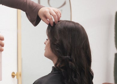 Stylist applying hairspray at SBM The Salon, Boronia Heights, Queensland, AU.
