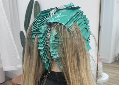 Hair coloring in progress at SBM The Salon, Boronia Heights, Queensland, AU with green foils applied.