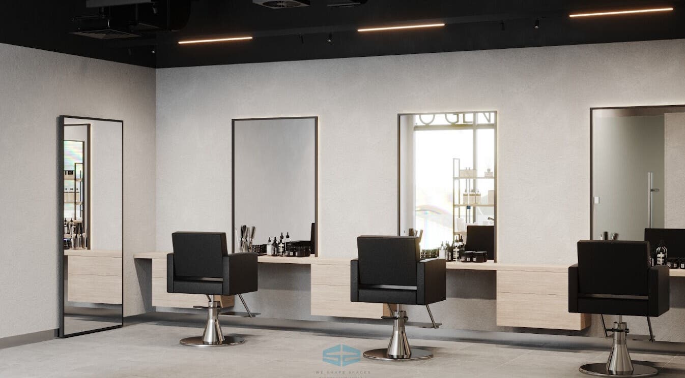 Interior of BROUSE. Gents Salon, Dubai, AE with sleek black chairs and mirrors in a stylish setting.