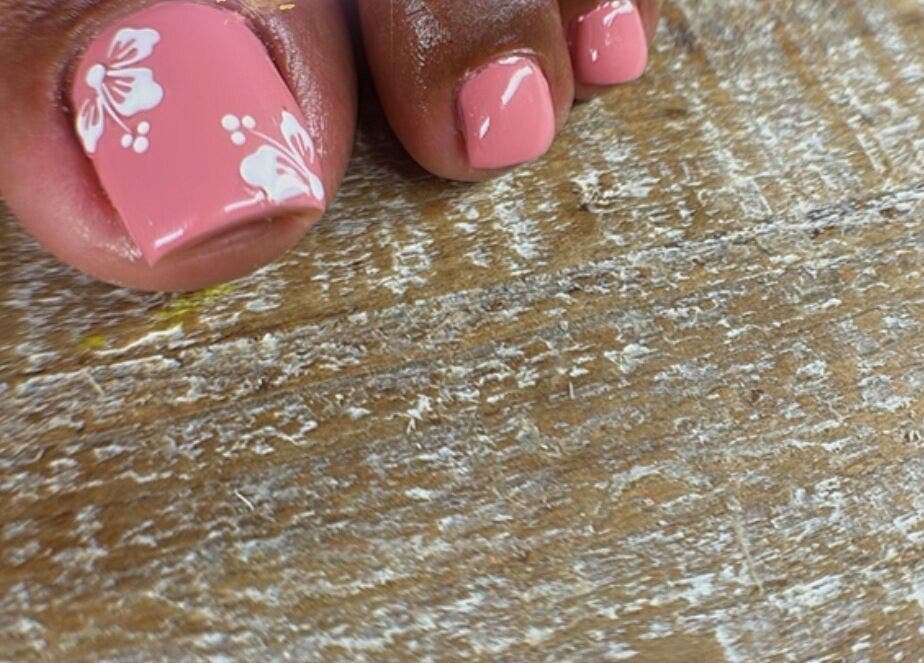 Pink toenails with floral design at Blossom Nails By Tash, Kralendijk, Bonaire, BQ.