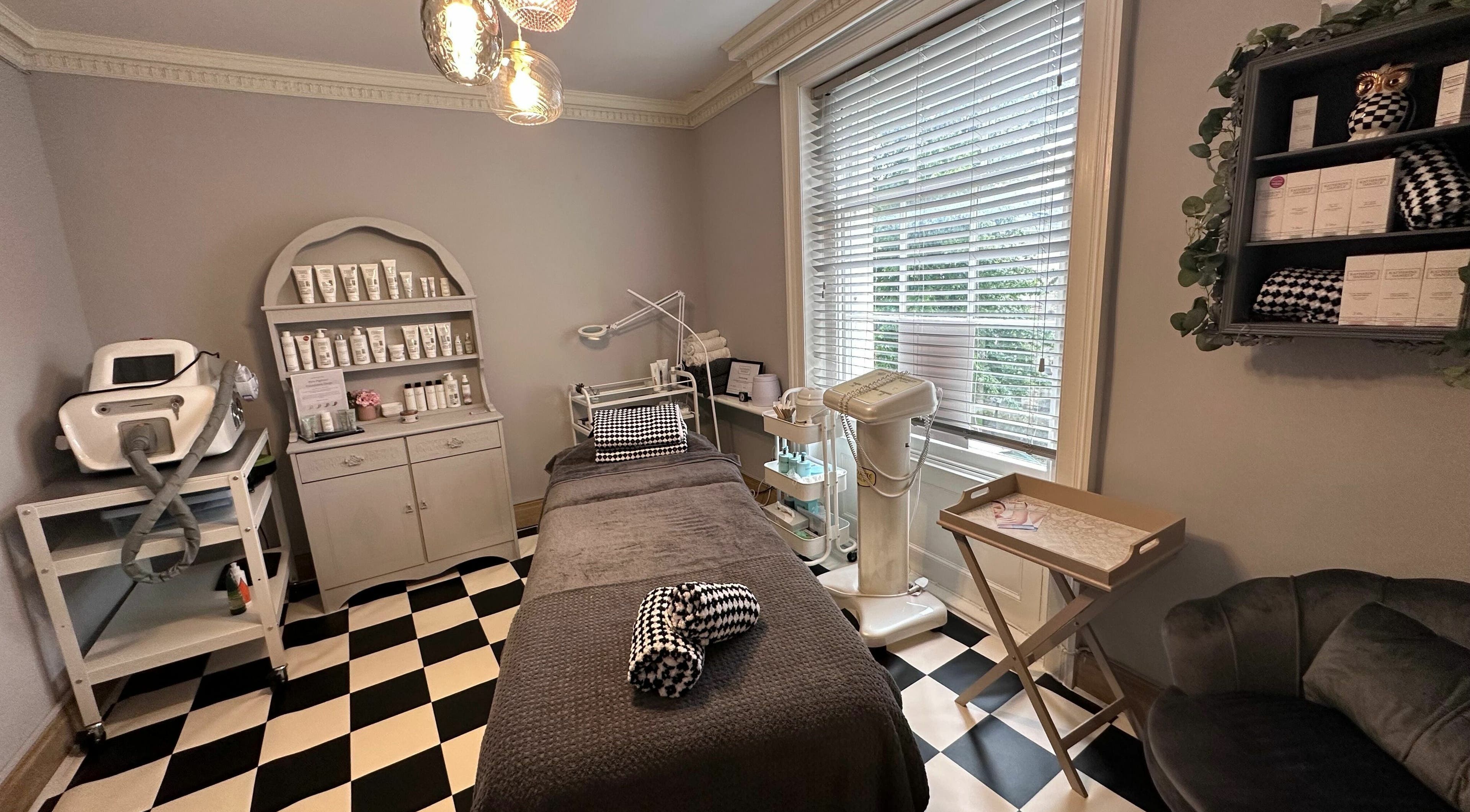 Cozy treatment room at Wonderland Beauty, Cheltenham, England, GB with modern equipment and stylish decor.
