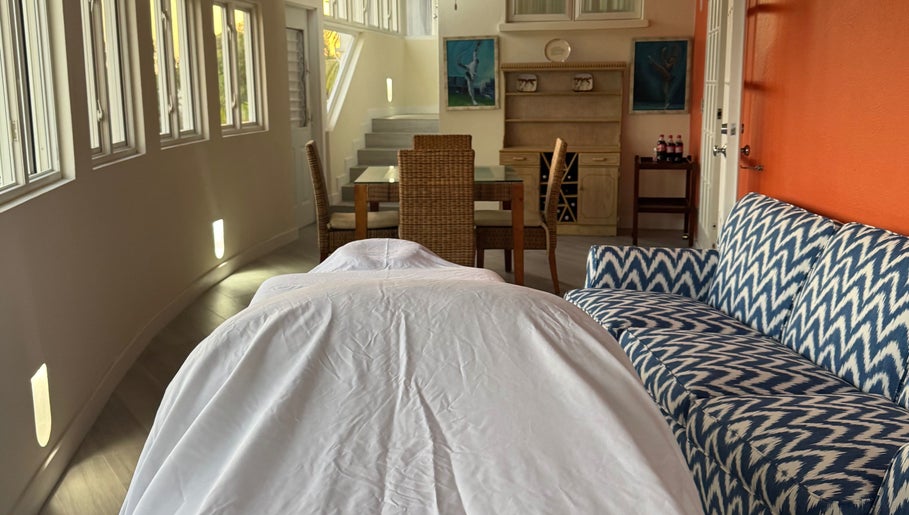 Relaxing massage room at Mobile Treatments in Saint Michael, BB featuring cozy decor and stylish furniture.