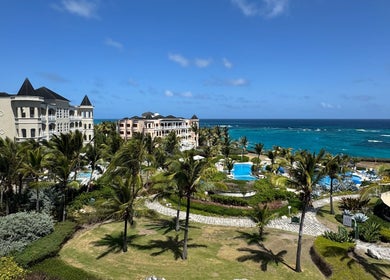 Scenic view of Mobile Treatments venue by the sea in Saint Michael, Saint Michael, BB with palm trees and pool.
