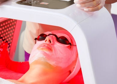 LED facial therapy at IQ Derma Cape Town, Western Cape, ZA enhances skin rejuvenation with soothing glow.