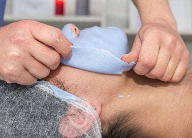Relaxing face mask treatment at IQ Derma Cape Town, Western Cape, ZA, promising rejuvenated skin.