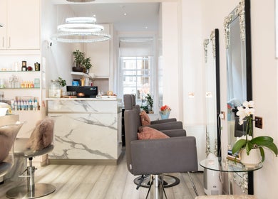 Interior of NOGTI Nails Fitzrovia, London, England, GB: sleek design with elegant decor and comfortable chairs.