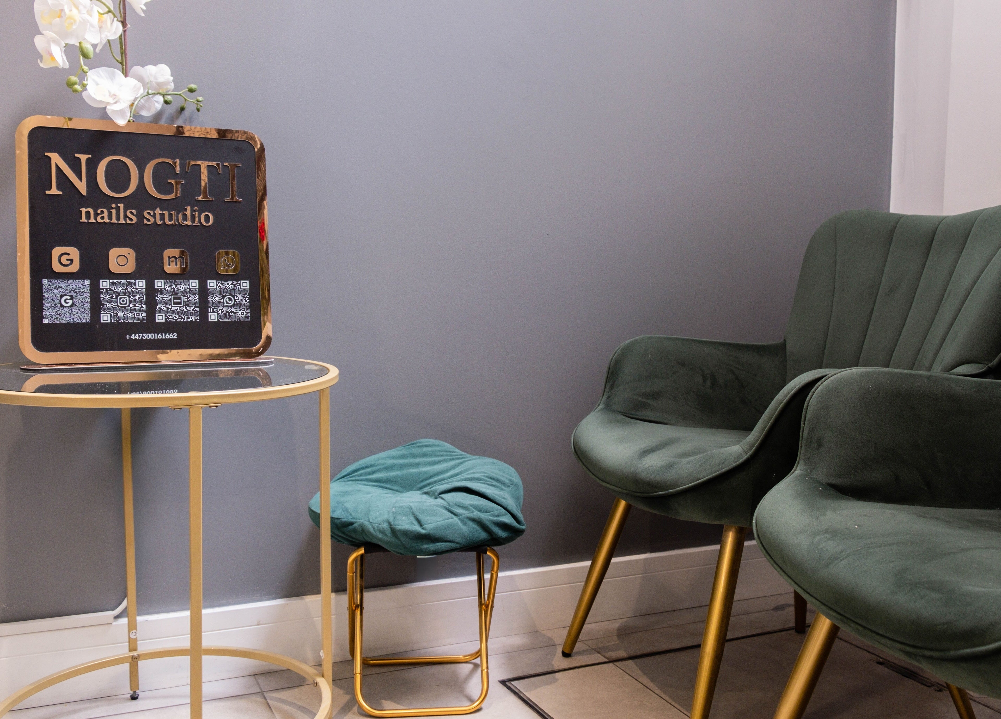 Cozy seating area at Nogti Nails Studio Fulham, London, England, GB with stylish decor.