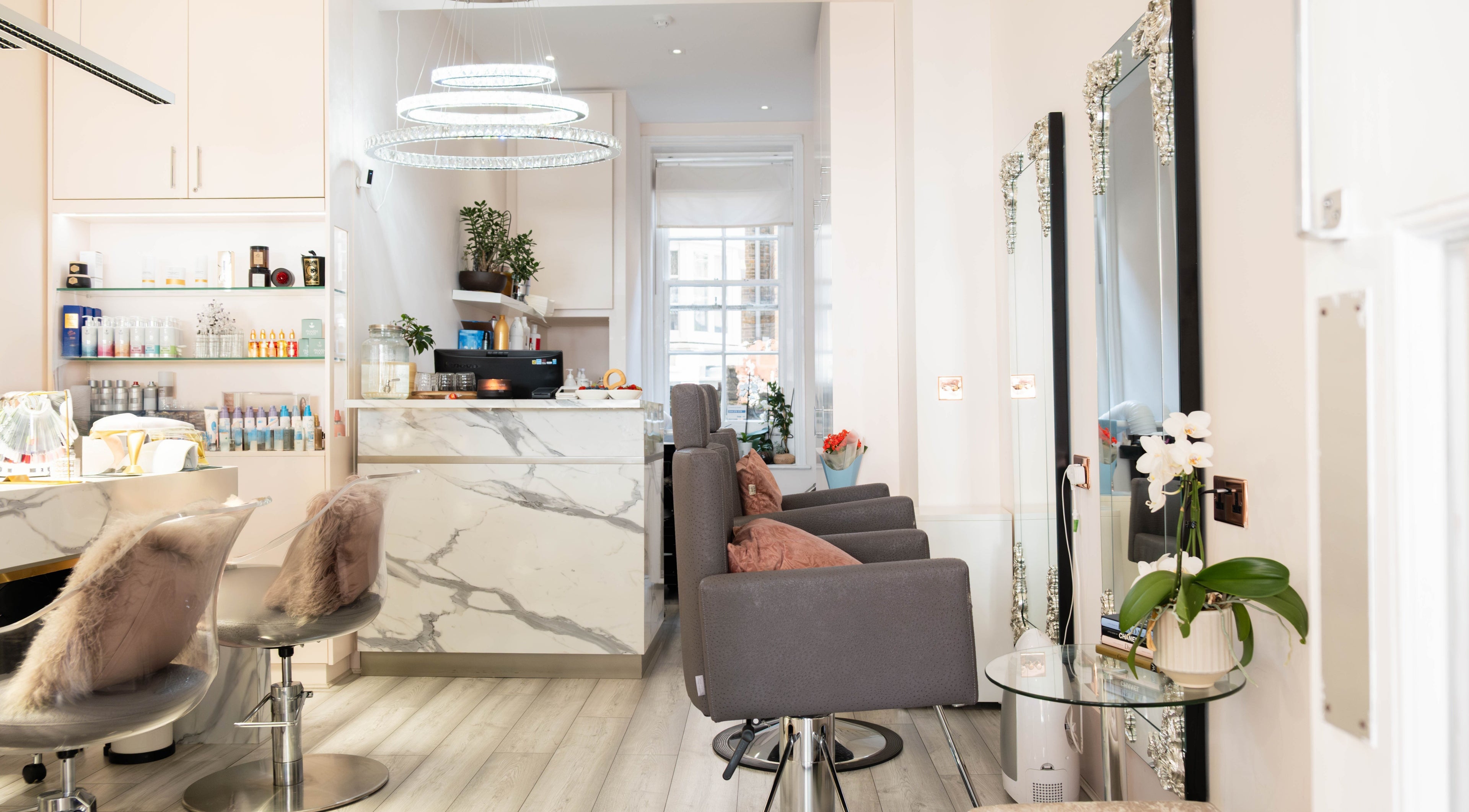 Elegant interior of NOGTI Nails Fitzrovia, London, England, GB, featuring plush seating and modern decor.