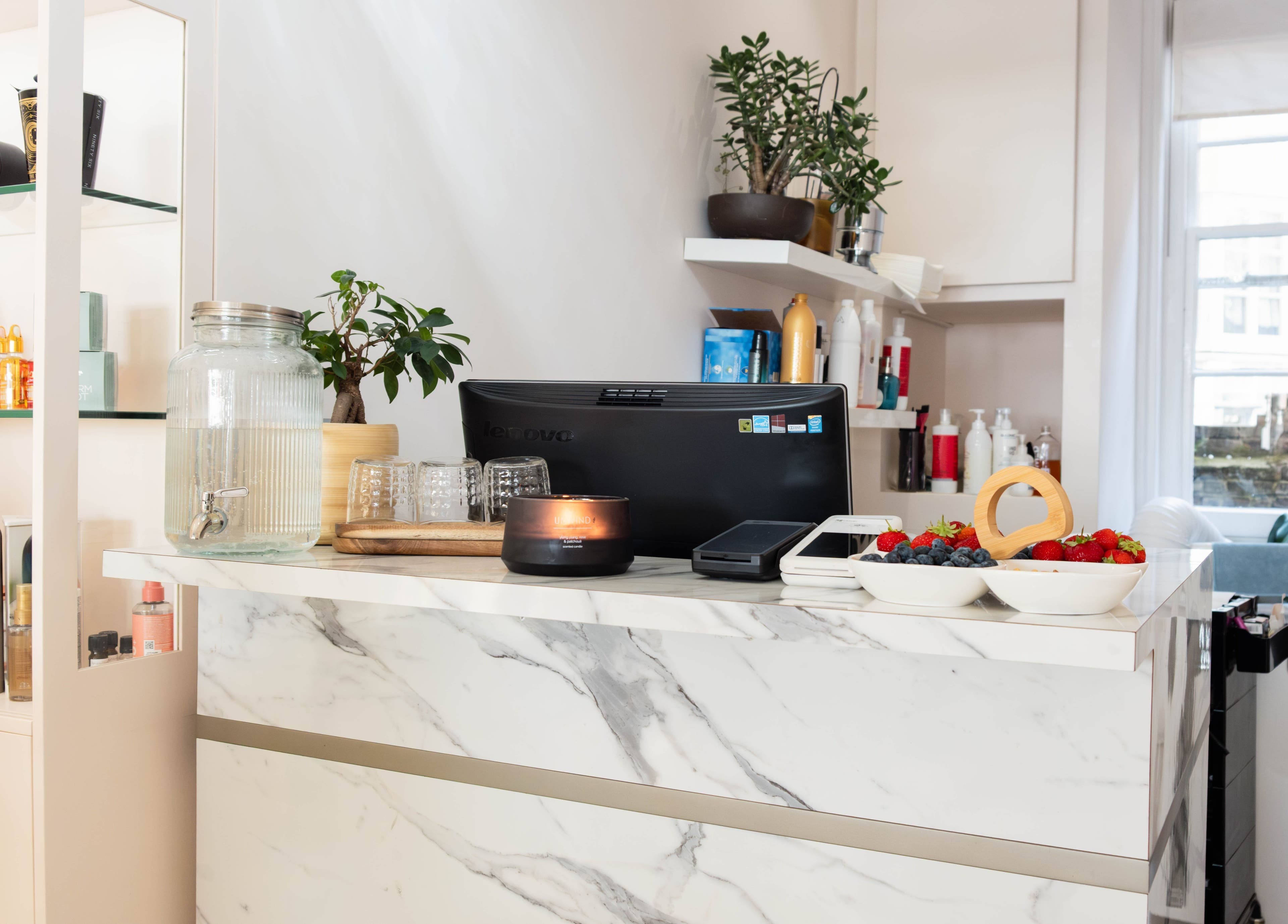 Reception area at NOGTI Nails Fitzrovia in London, England, GB with elegant decor and fruit bowls.