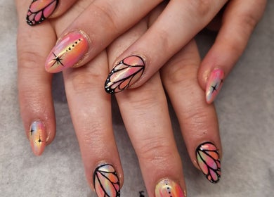 Intricate butterfly nail art at Celestial Nails Balloch, Balloch, Scotland, GB with vibrant colors and delicate designs.