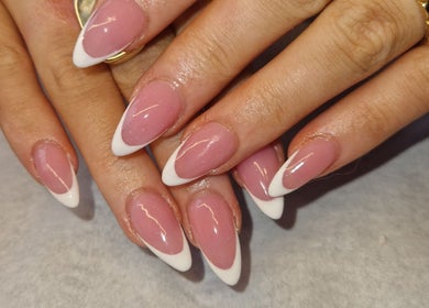 Elegant French manicure at Celestial Nails Balloch, Balloch, Scotland, GB featuring glossy pink and white tips.