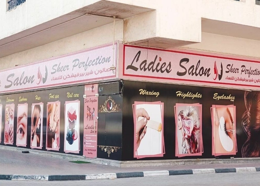Exterior of Sheer Perfection Ladies Salon in Dubai, Dubai, AE showcasing beauty services with vibrant signage.