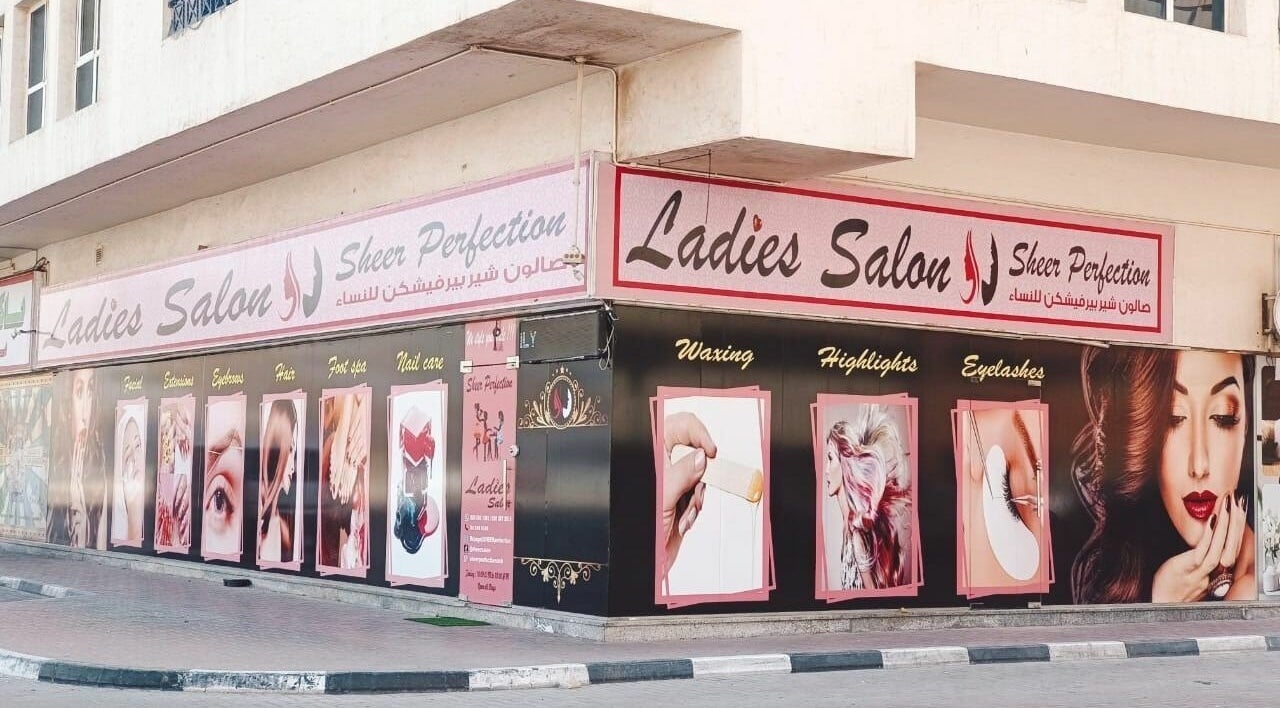 Exterior of Sheer Perfection Ladies Salon in Dubai, Dubai, AE showcasing beauty services with vibrant signage.