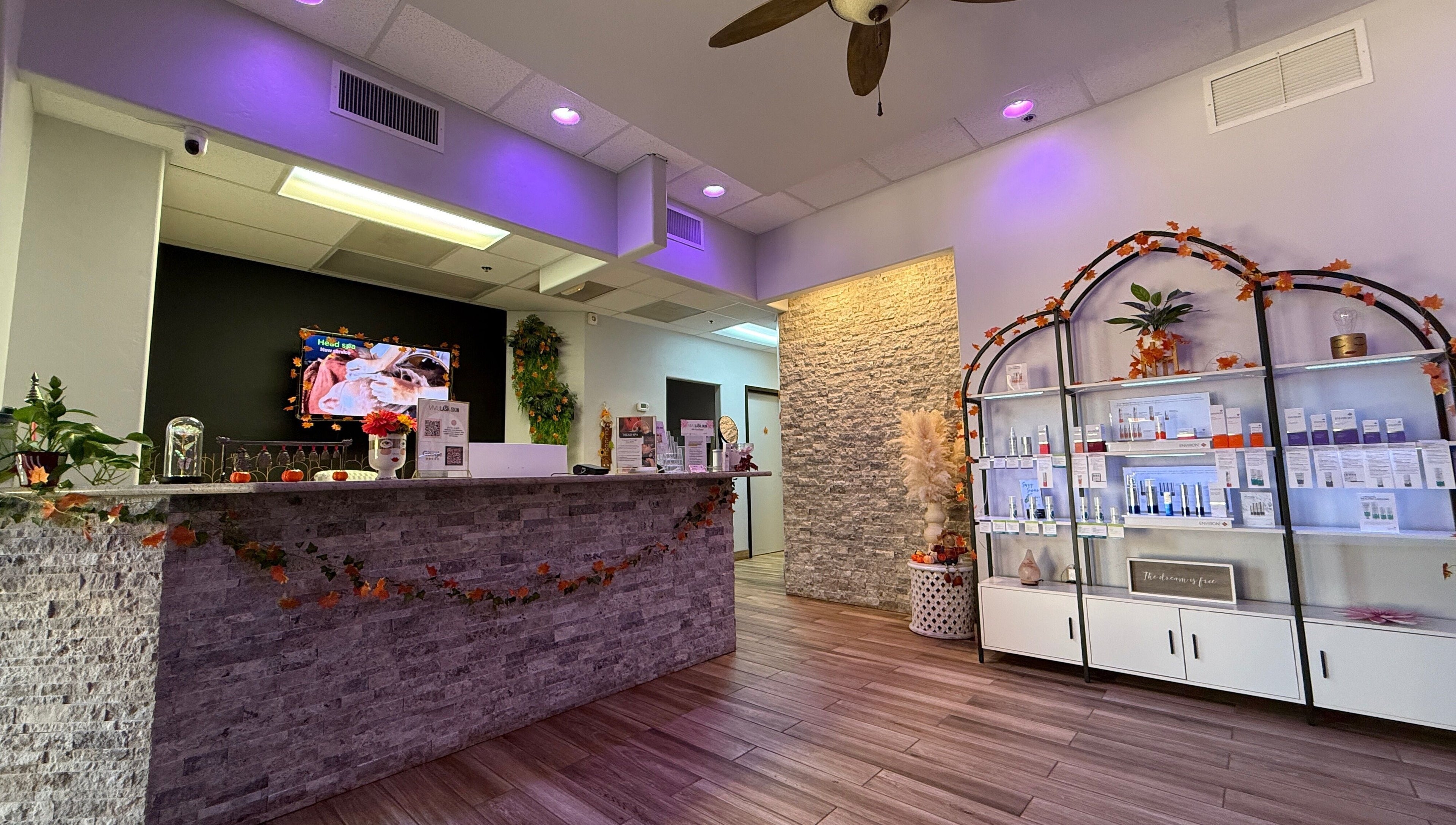 Welcoming interior of Vivu Lash & Skin in Tucson, Arizona, US, showcasing calming decor and product display.