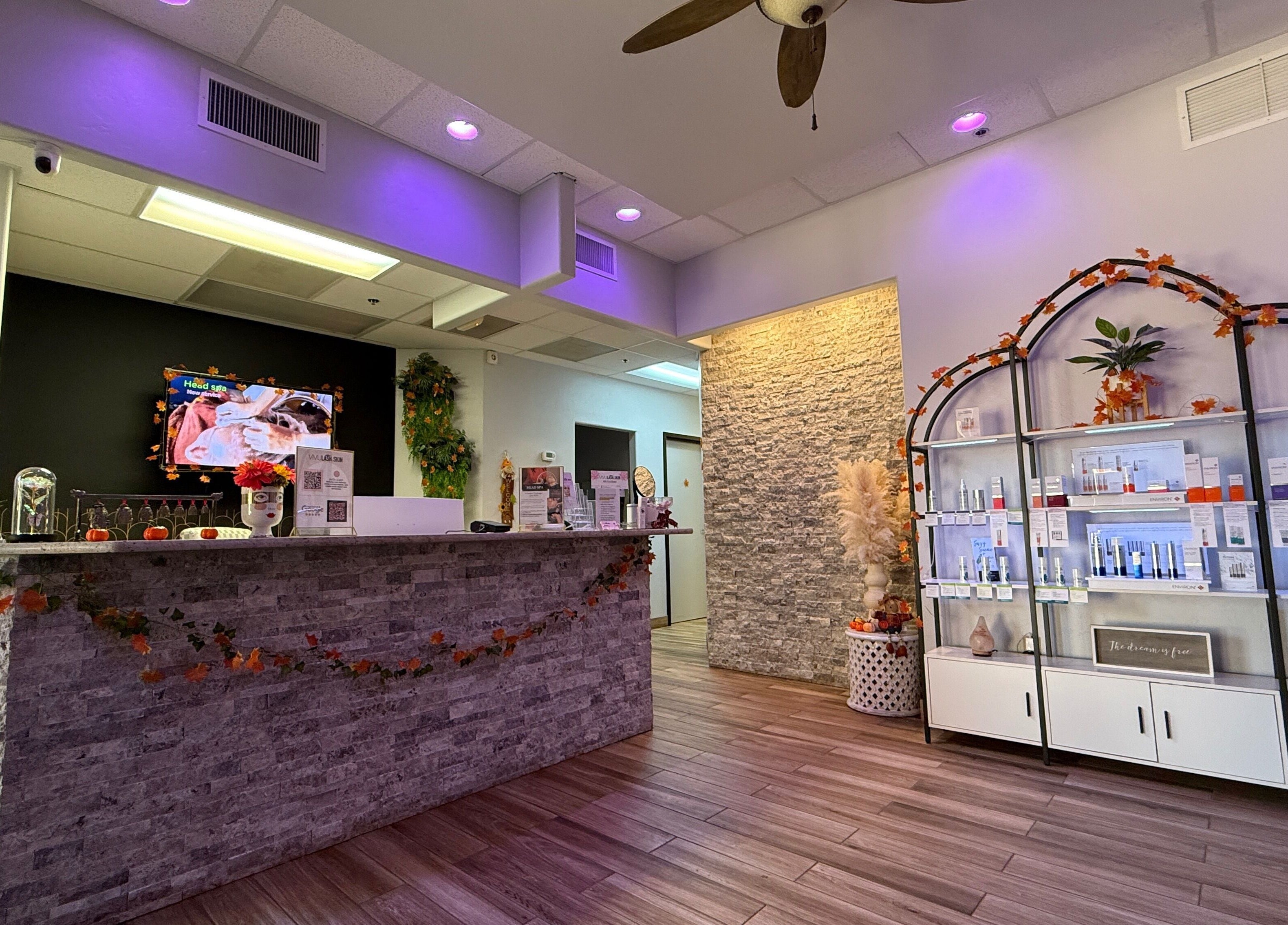 Welcoming interior of Vivu Lash & Skin in Tucson, Arizona, US, showcasing calming decor and product display.
