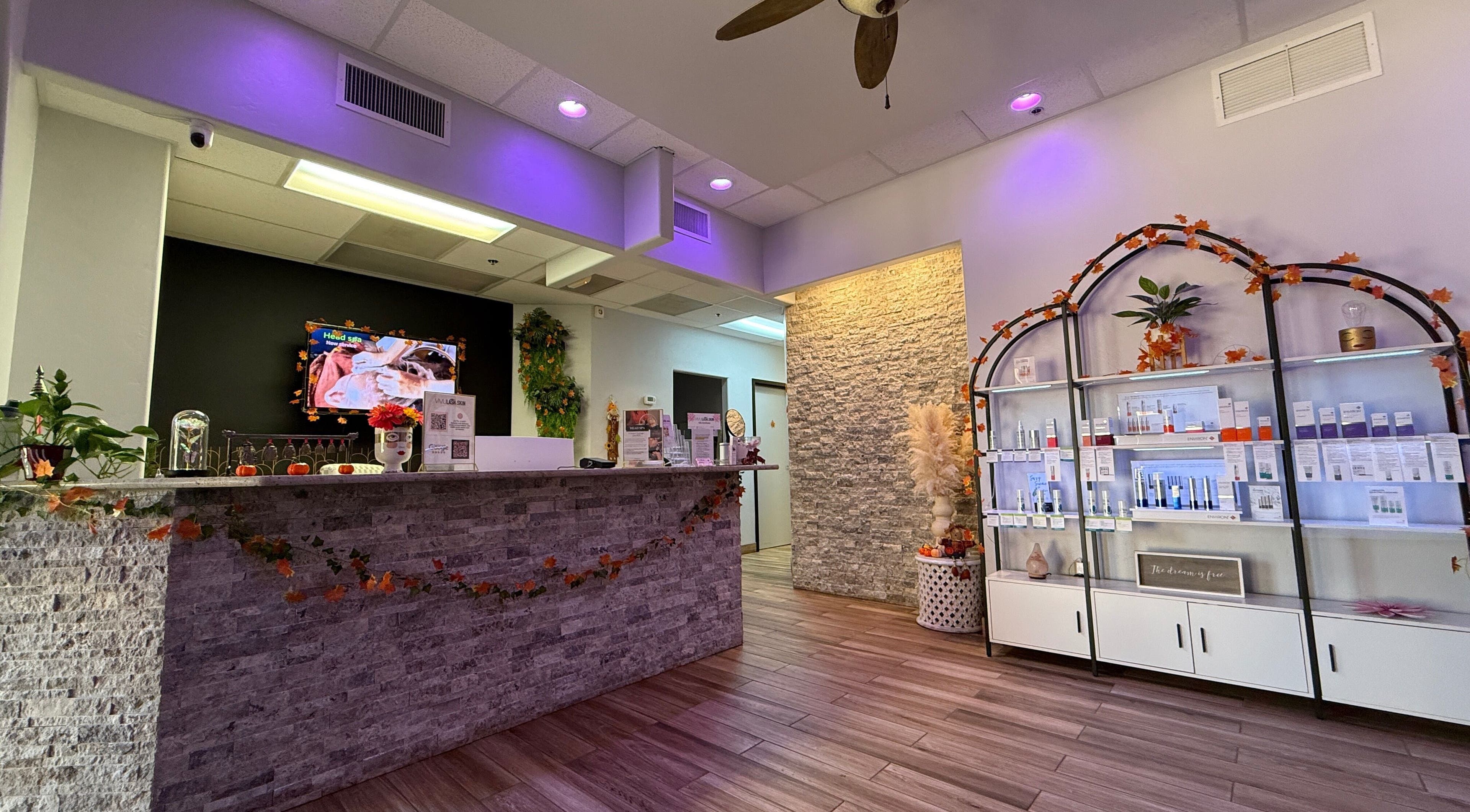 Welcoming interior of Vivu Lash & Skin in Tucson, Arizona, US, showcasing calming decor and product display.