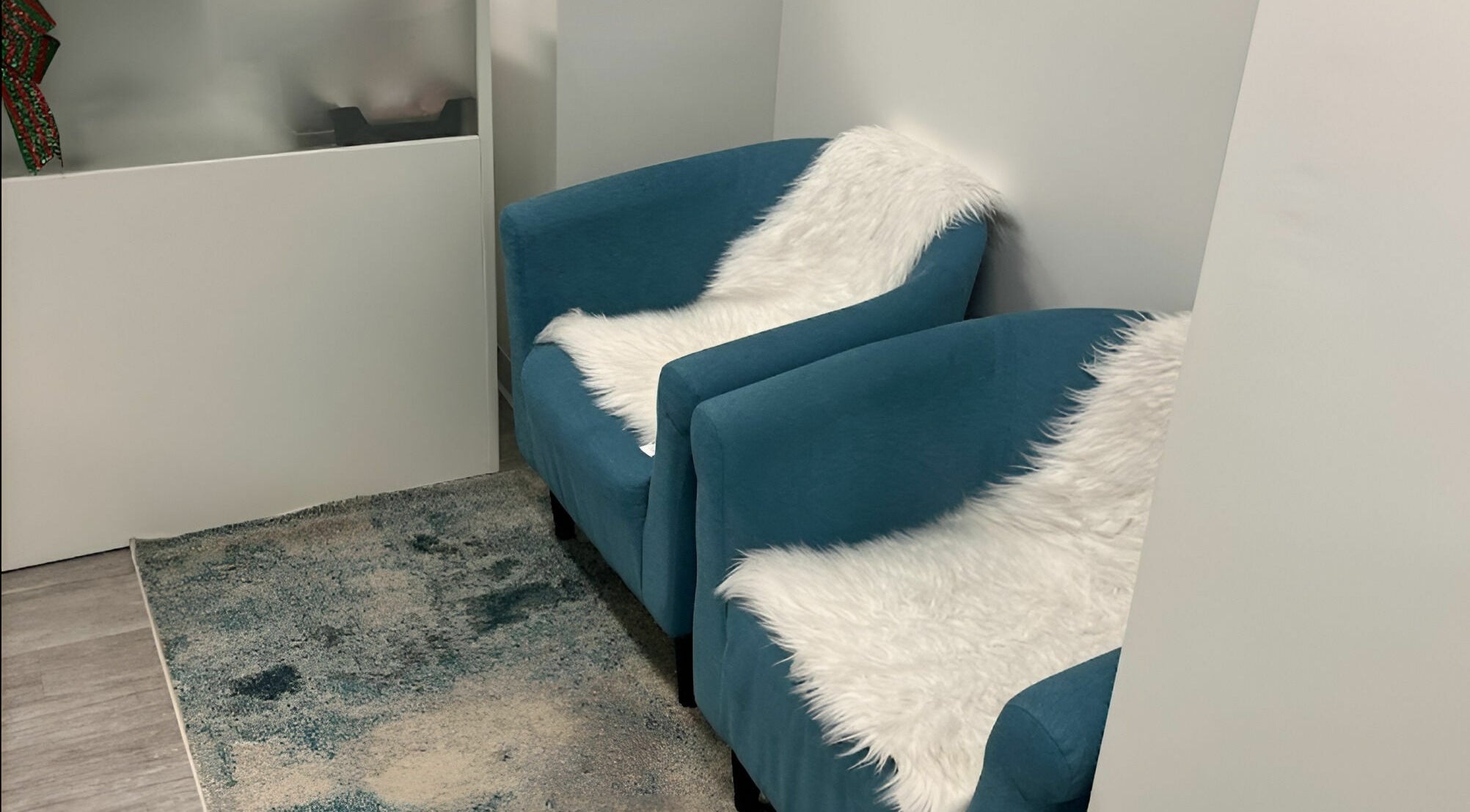 Comfortable blue chairs with faux fur at Unique Massage Spa, Fairfax, Virginia, US awaiting relaxation.
