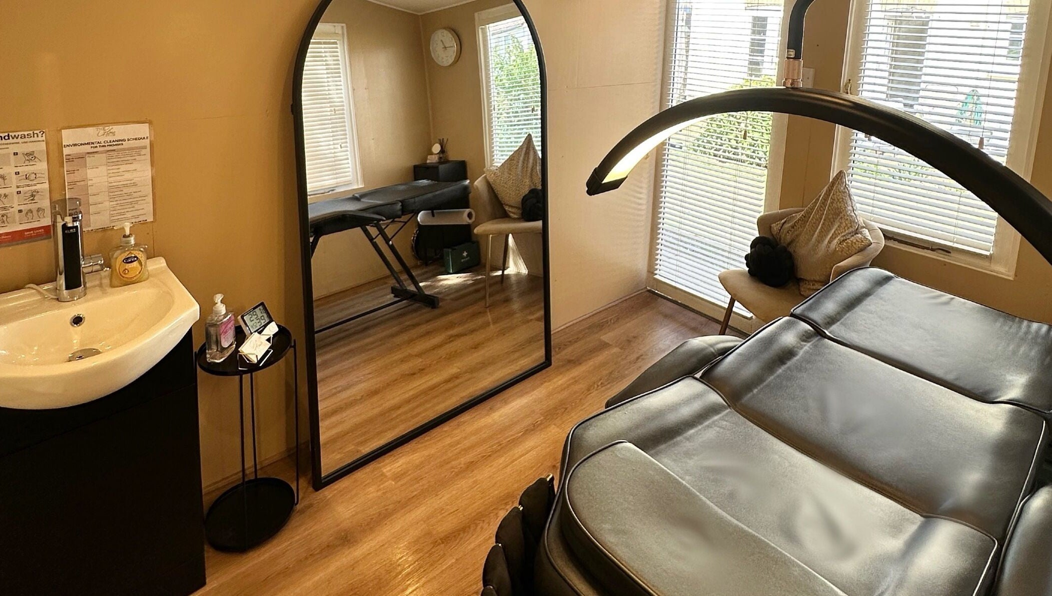 Spa room at The Glow Hub in Black Notley, England, GB featuring a massage bed and modern decor.