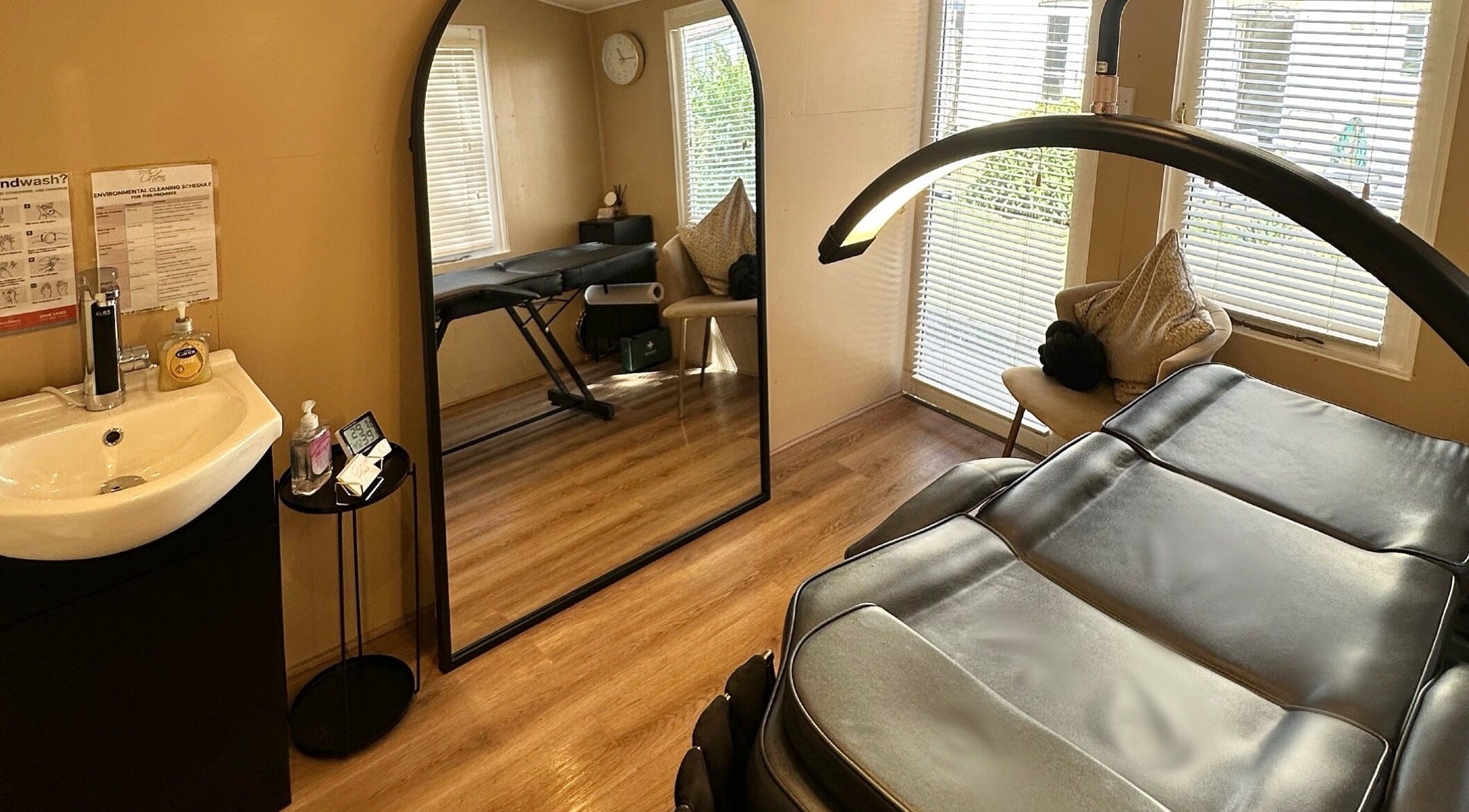 Spa room at The Glow Hub in Black Notley, England, GB featuring a massage bed and modern decor.