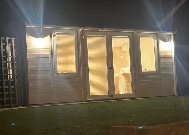 The Glow Hub venue in Black Notley, England, warmly lit in the evening. A tranquil wellness space.