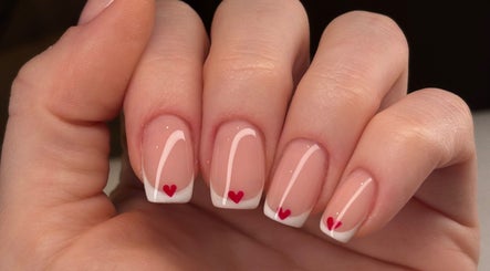 Beautiful French manicure with heart design at Be Beautiful by Gee, Cheltenham, England, GB.
