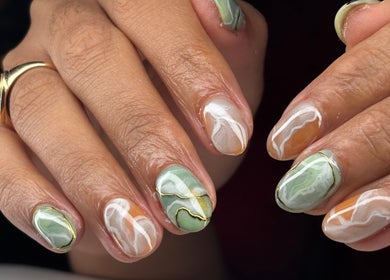 Elegant marble nail art at Be Beautiful by Gee in Cheltenham, England, GB showcasing intricate design.