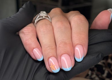 Elegant summer nail art with sea star detail at Be Beautiful by Gee, Cheltenham, England, GB.