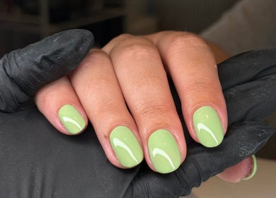 Lime green nail art at Be Beautiful by Gee, Cheltenham, England, GB. Perfect, glossy manicure.