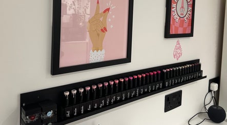Nail polish display with framed art at Cured by Beth, Edinburgh, Scotland, GB.