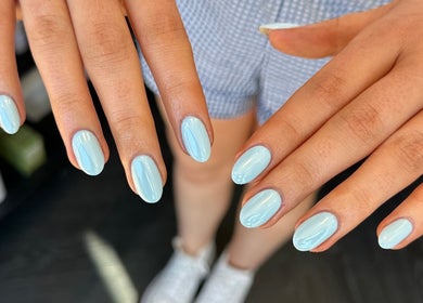 Light blue manicured nails at Cured by Beth, Edinburgh, Scotland, GB showcasing elegance and style.