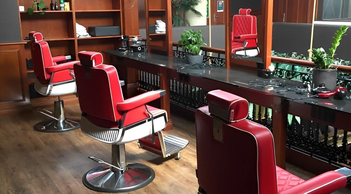 Stylish red barber chairs in The Mo' Rooke Lane, Devonport, Tasmania, AU, showcasing modern elegance.