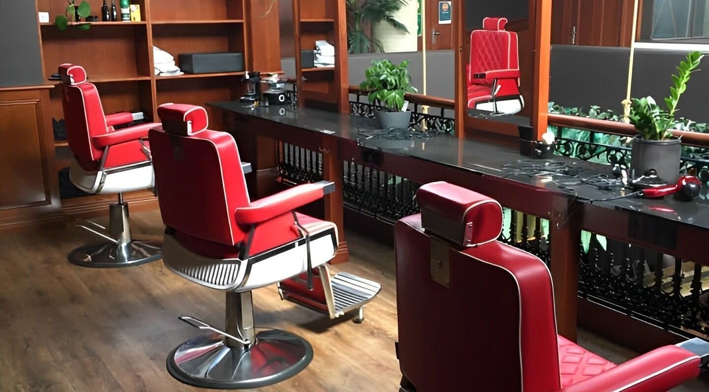 Stylish red barber chairs in The Mo' Rooke Lane, Devonport, Tasmania, AU, showcasing modern elegance.