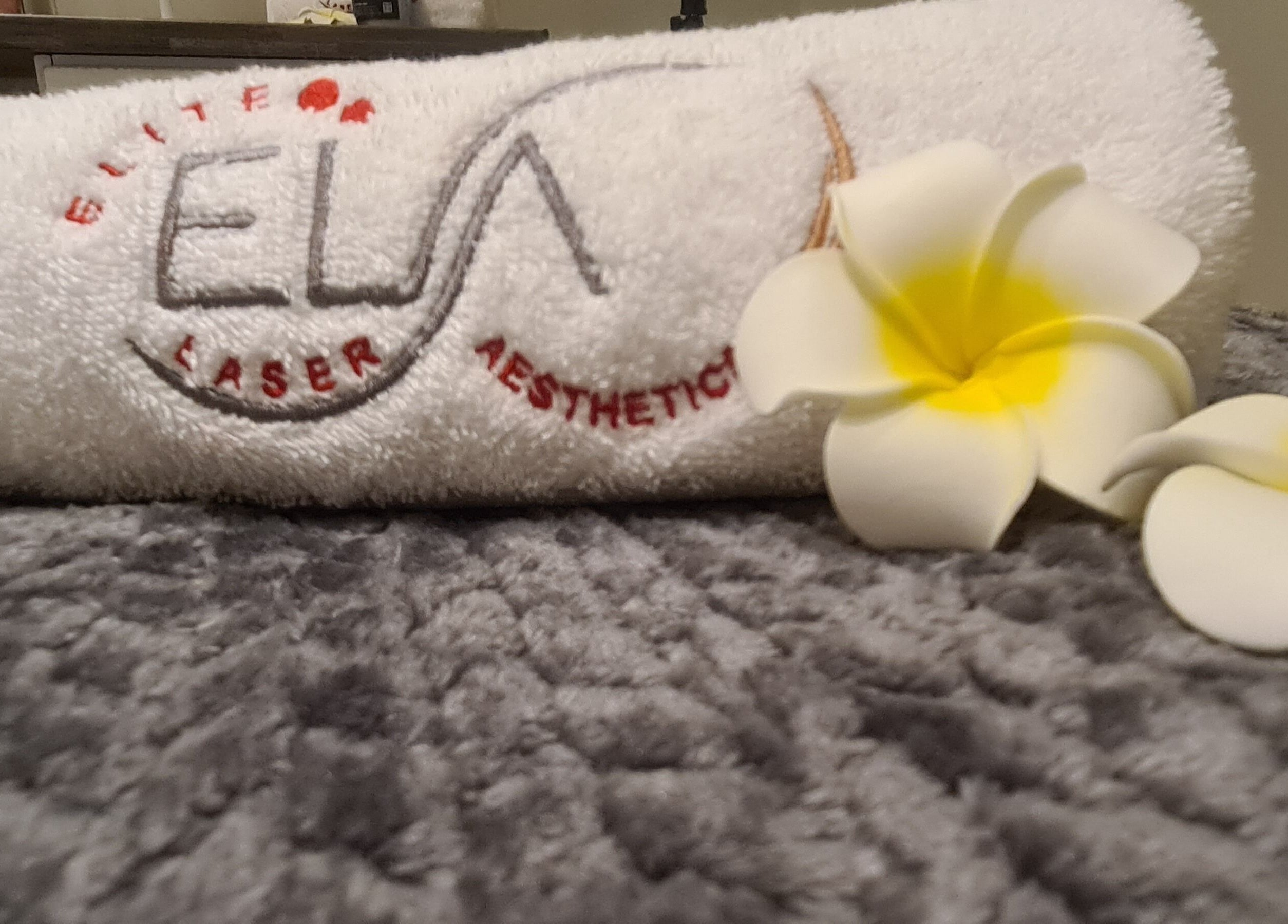 Elite Laser Aesthetics towel with flowers, Randburg, Gauteng, ZA. Elegant and calming ambiance.