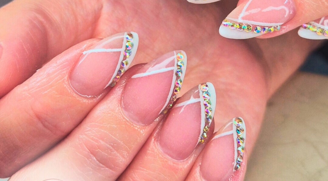 Elegant nail art with rhinestones at Polish Me Pretty in New Addington, England, GB.