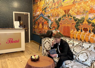 Na Thai Therapy's vibrant interior with detailed mural in Birmingham, England, GB.