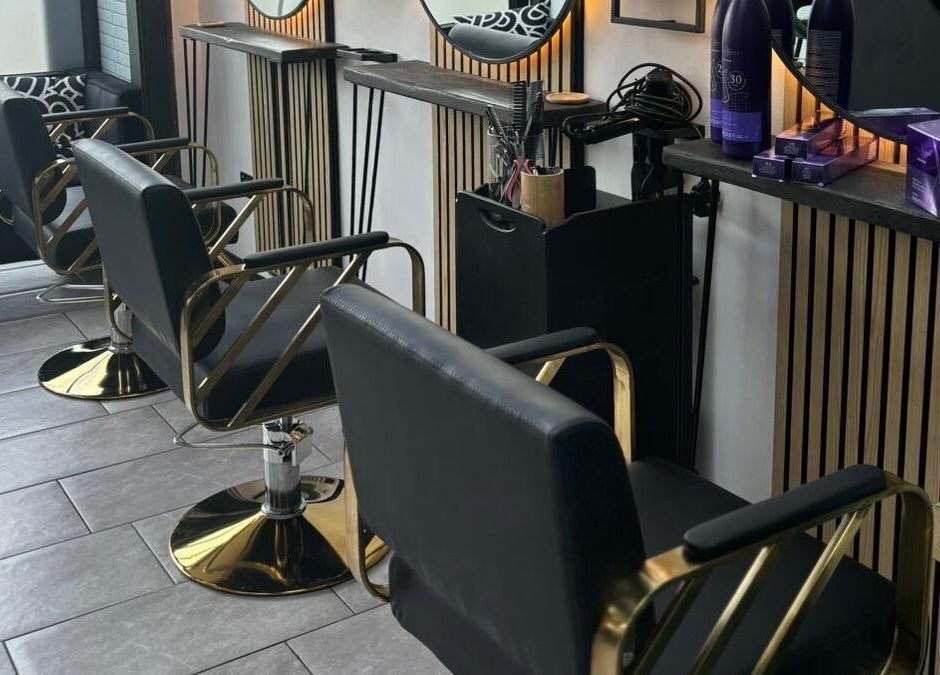 Elegant salon chairs at Black & Bamber, Hull, England, GB, creating a sleek and modern styling area.