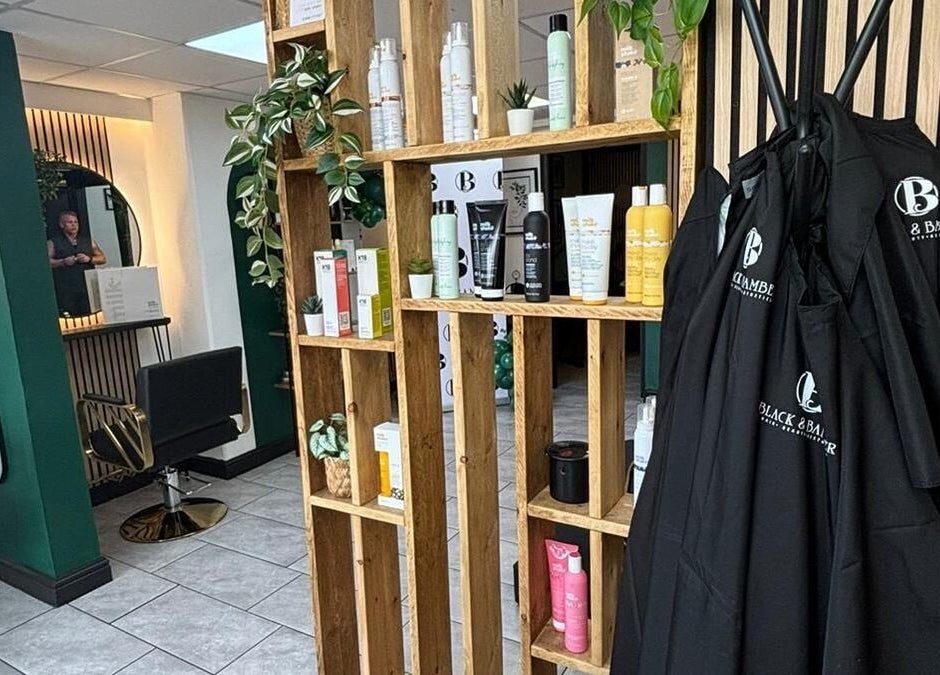 Elegant salon interior of Black & Bamber in Hull, England, showcasing beauty products and stylish design.