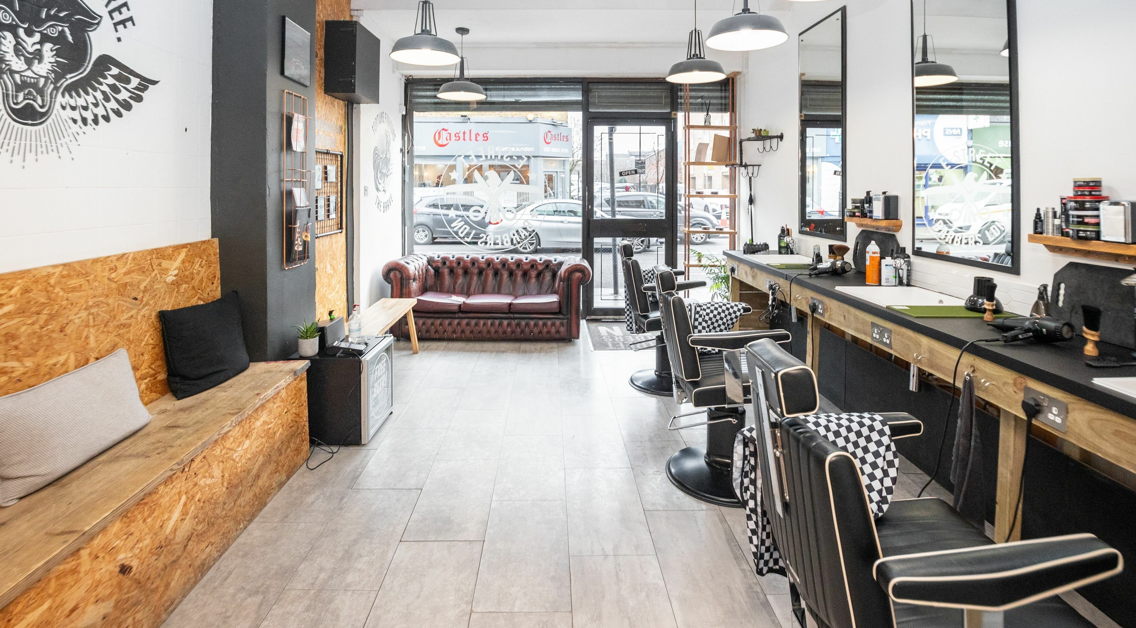 E-Street Barbers LDN interior showcasing stylish barber chairs and decor in London, England, GB.
