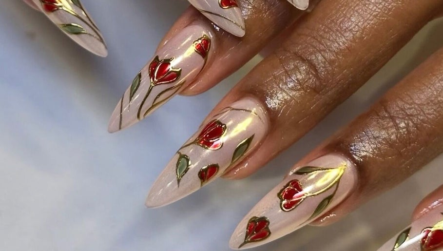 Elegant floral nail art at Noire the nail bar orlando, Orlando, Florida, US. Stylish red and green accents.